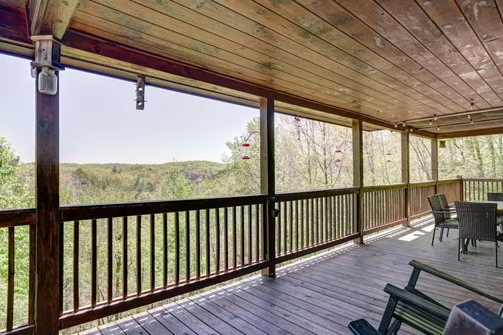 Rocking chairs on the wraparound porch looking out at the Blue Ridge